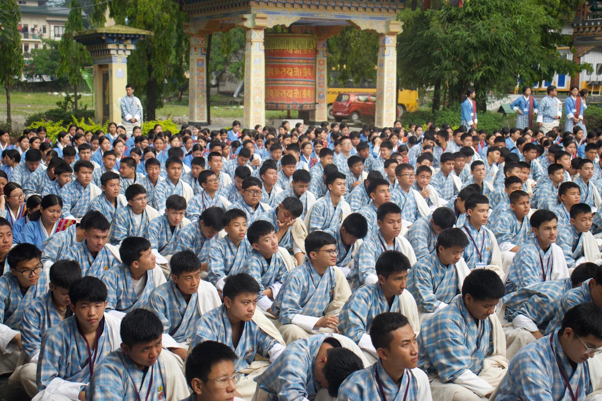 Students seated together during a school programme at PHSS